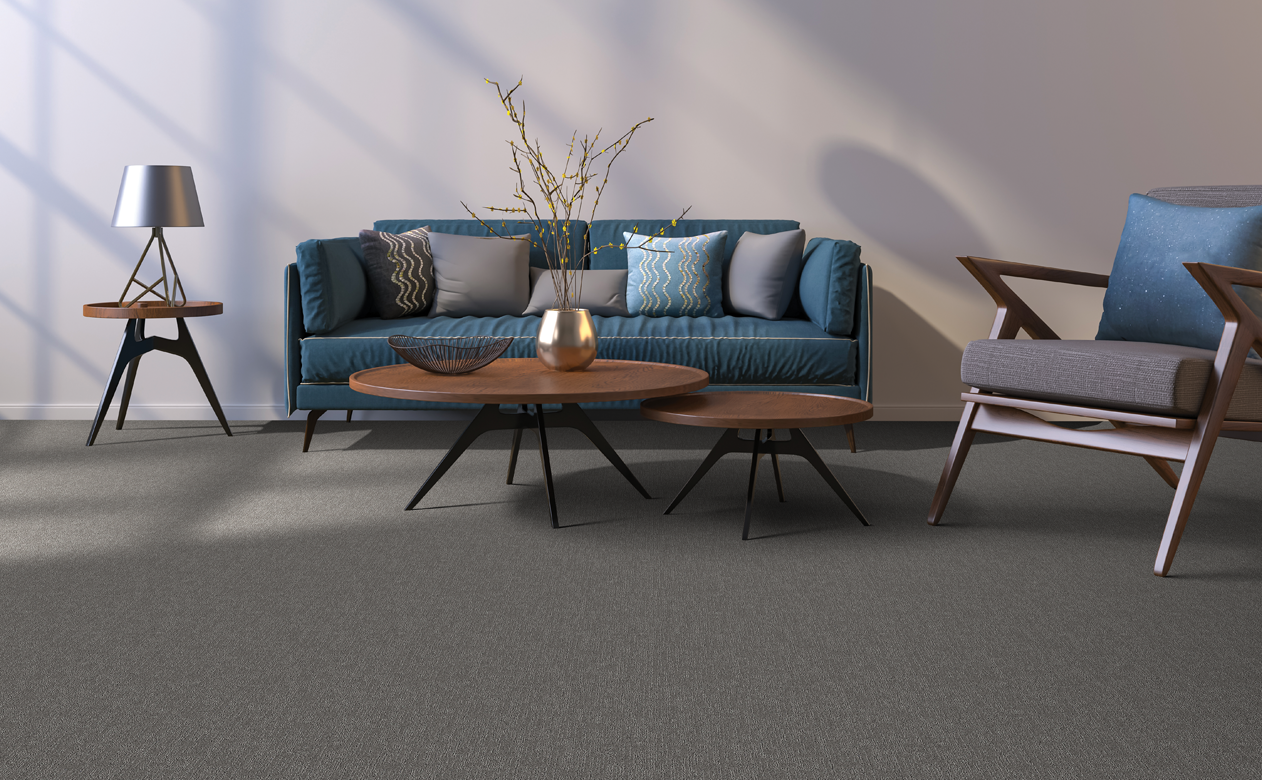 Berber carpet floor with blue modern sofa. 